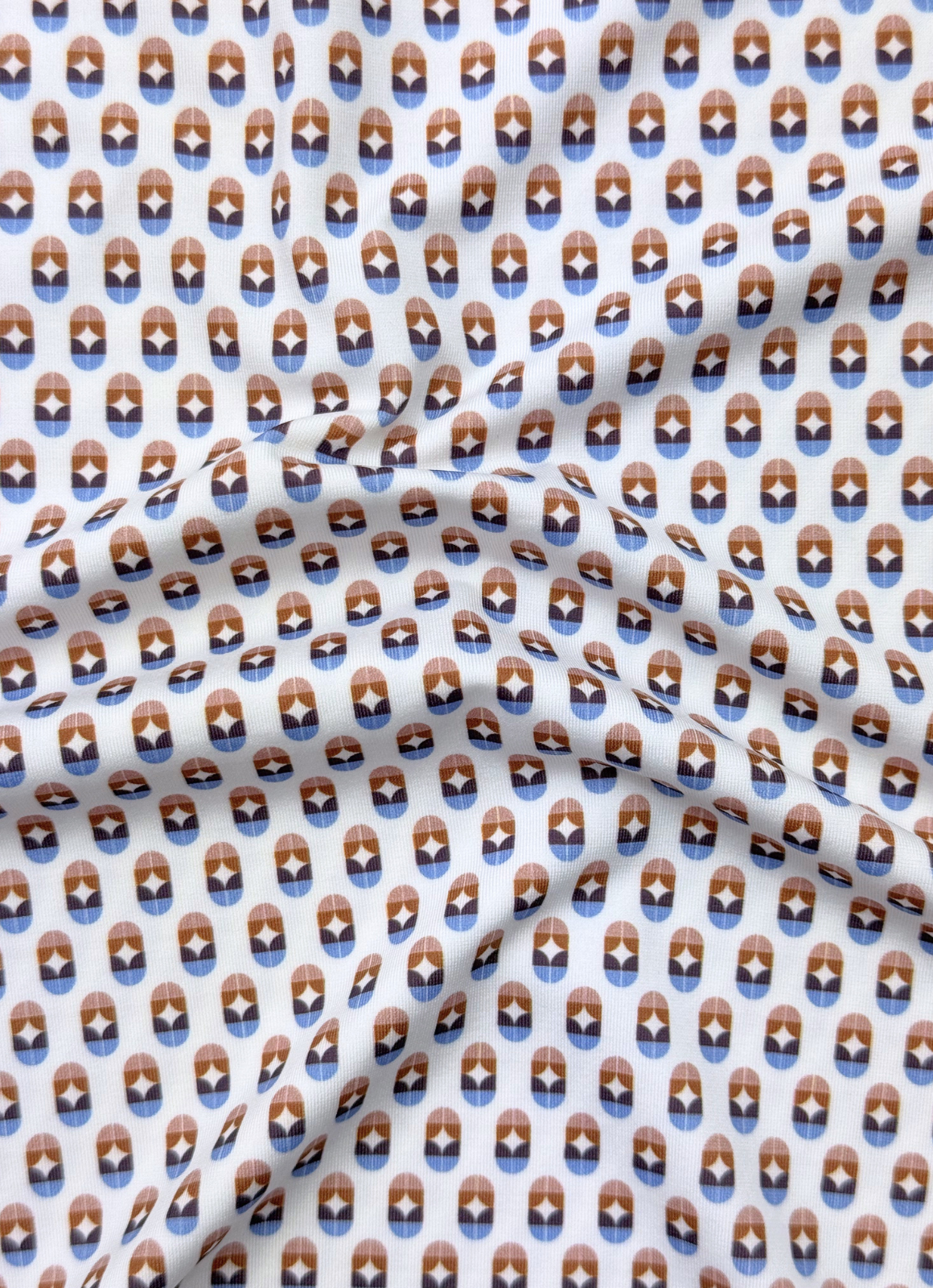 Printed Stretch Polo — Blue & Brown Pill Pattern, Buttery Smooth Fabric, Metal-Rimmed Buttons