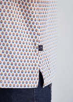 Printed Stretch Polo — Blue & Brown Pill Pattern, Buttery Smooth Fabric, Metal-Rimmed Buttons